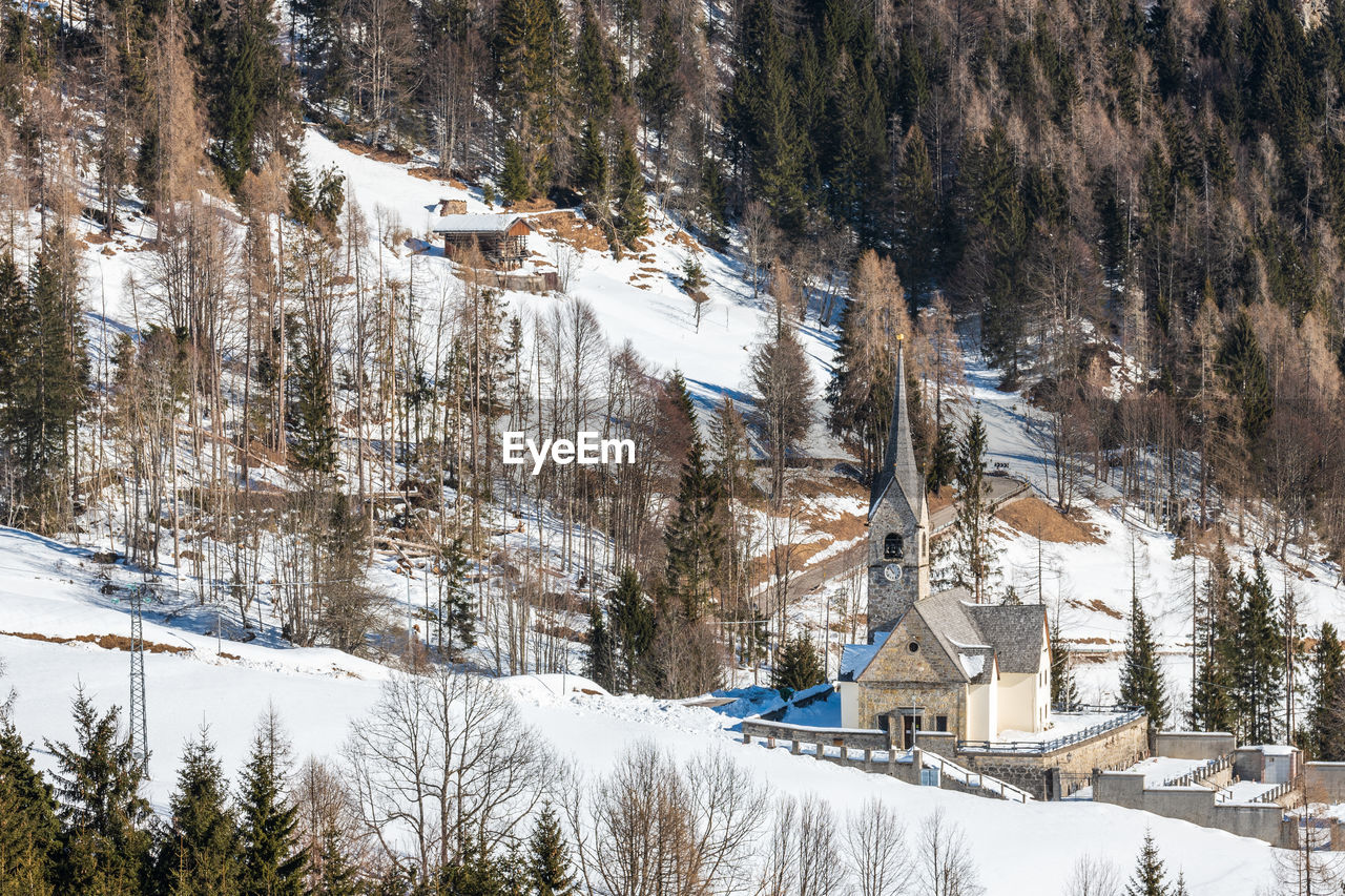 Winter magic. the ancient wooden houses of sauris di sopra. italy