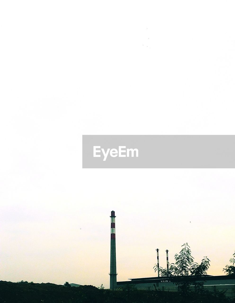 LIGHTHOUSE AGAINST SKY