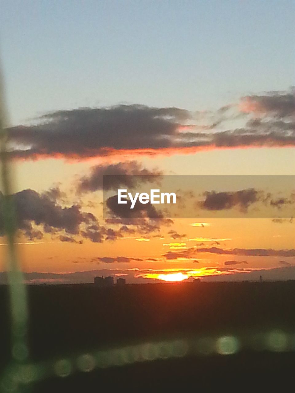 SCENIC VIEW OF DRAMATIC SKY OVER SILHOUETTE LANDSCAPE