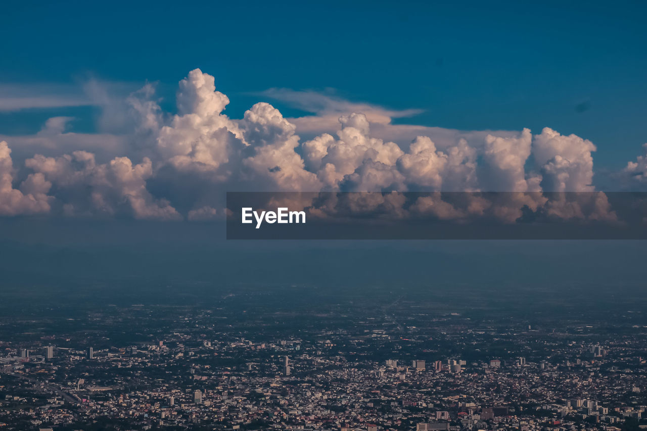 Aerial view of city against sky