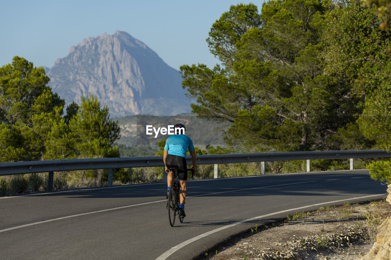 Man riding a bicycle on a costa blanca mountain road