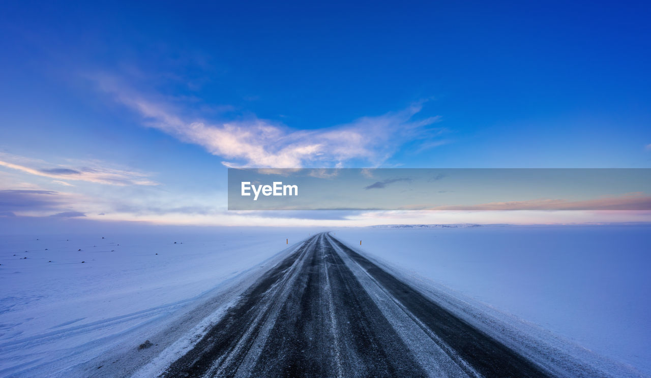 Surface level of ice road against sky during sunset iceland 