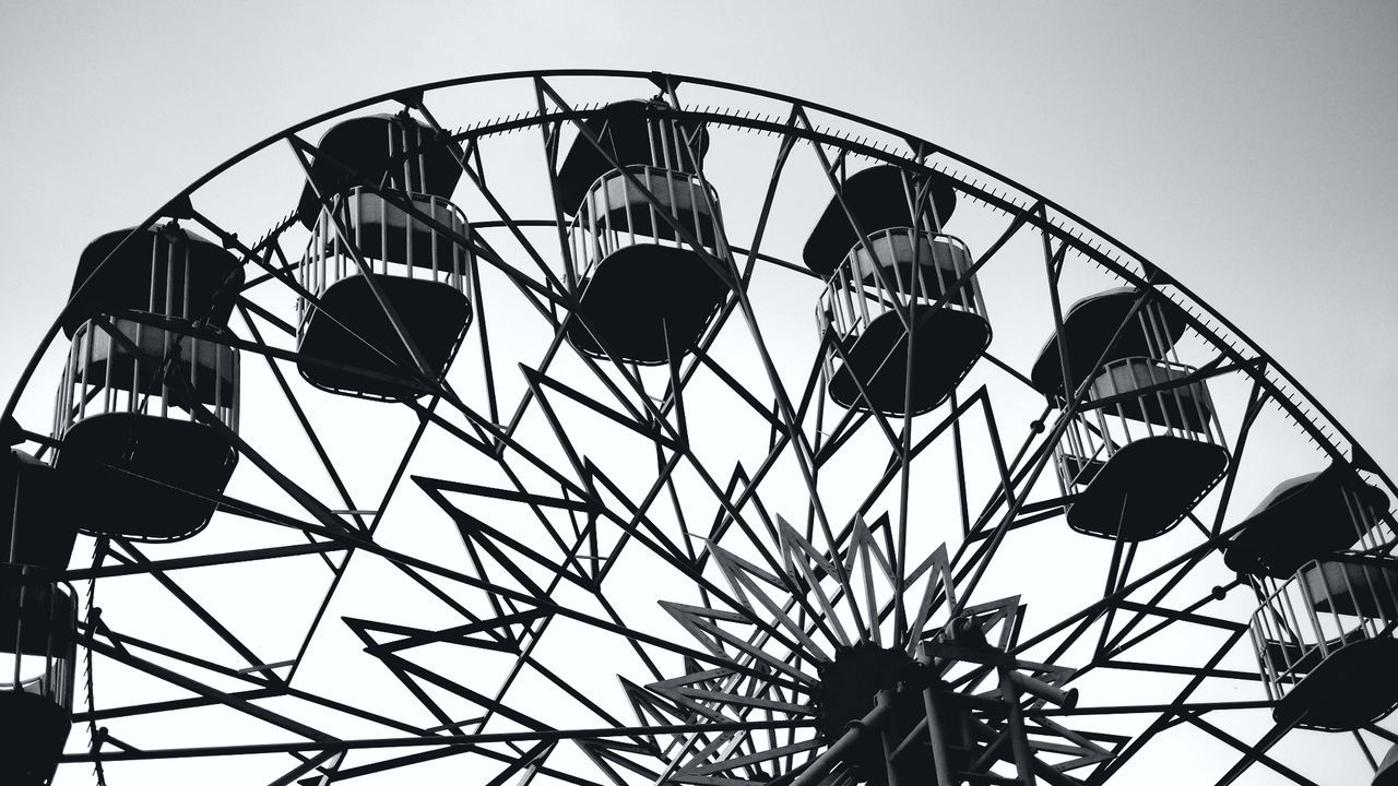 LOW ANGLE VIEW OF WHEEL AGAINST CLEAR SKY