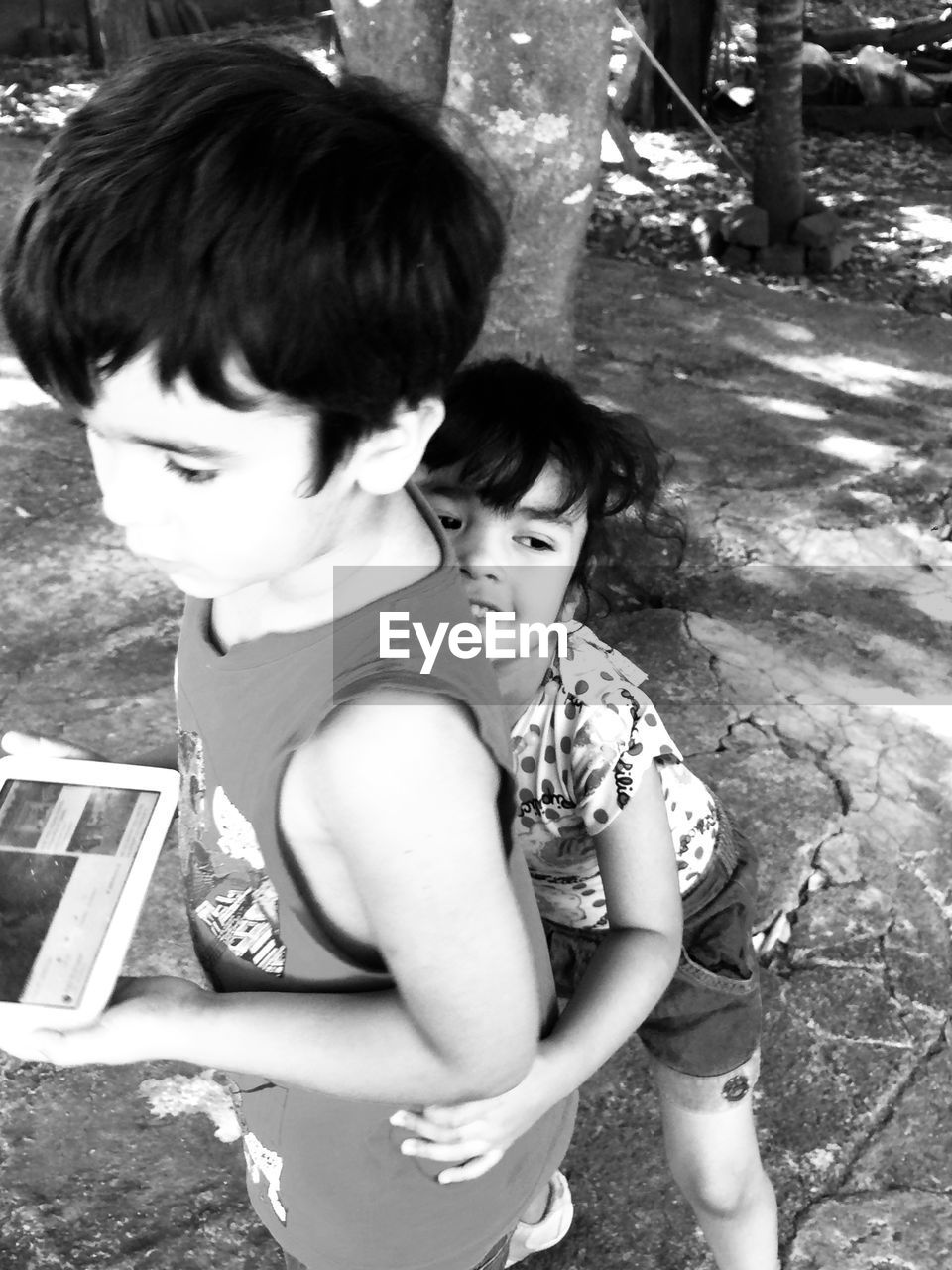 HIGH ANGLE VIEW OF BOY AND WOMAN LYING ON FLOOR