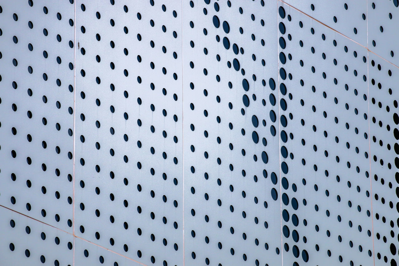 Low angle view of metallic wall