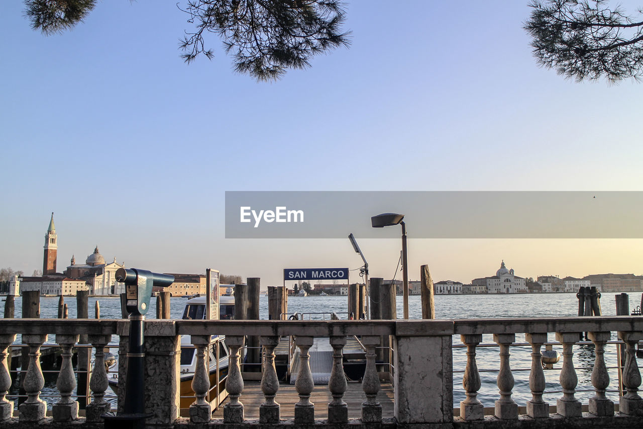 Mid distance view of san giorgio maggiore church by grand canal against clear sky