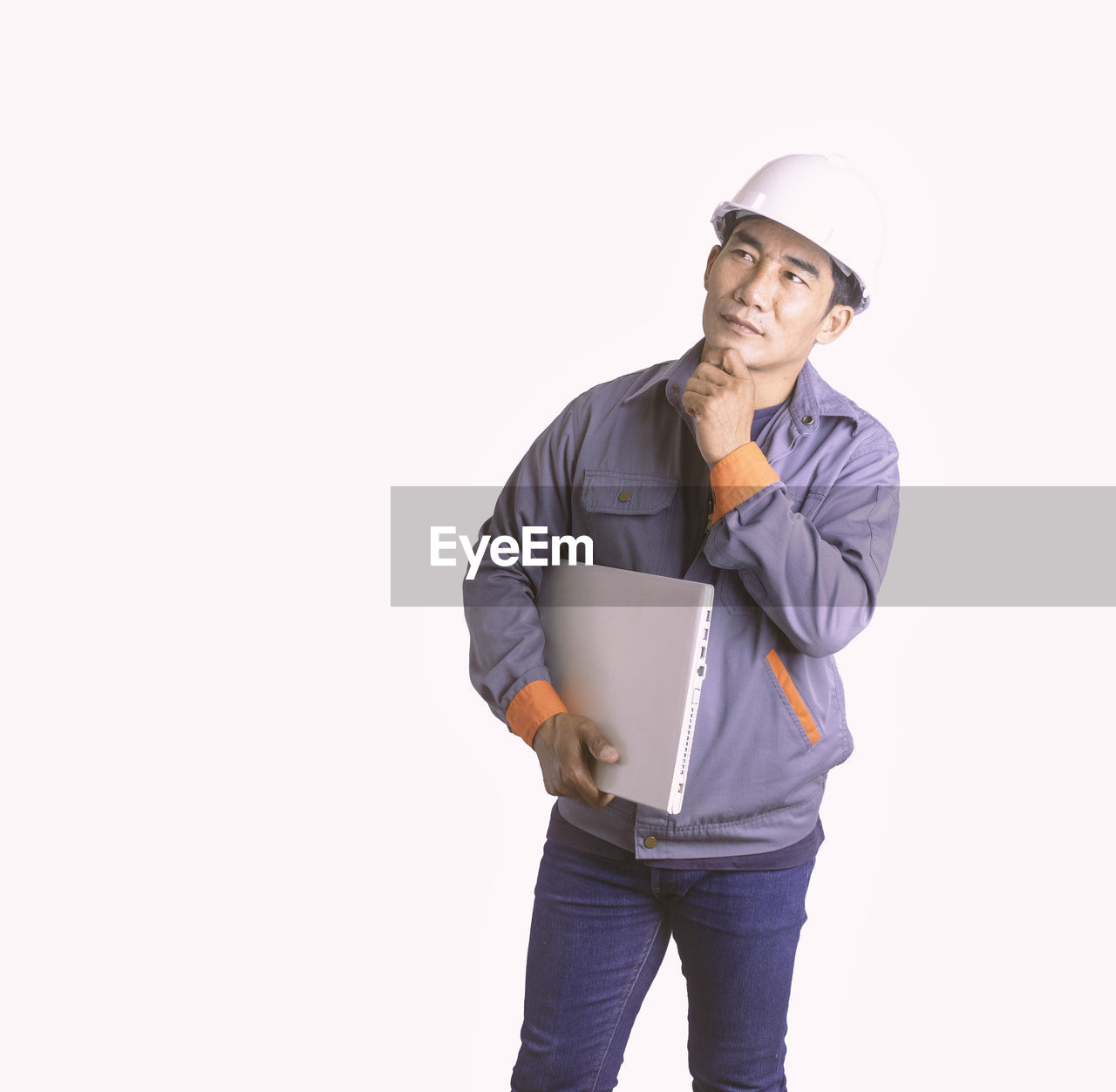 YOUNG MAN WEARING HAT AGAINST WHITE BACKGROUND