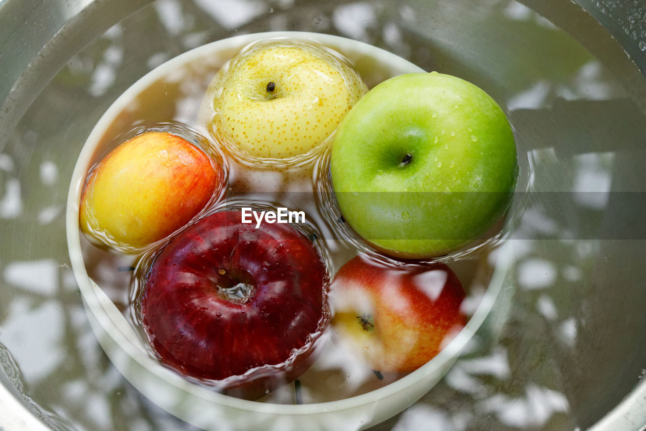 HIGH ANGLE VIEW OF FRUITS IN WATER
