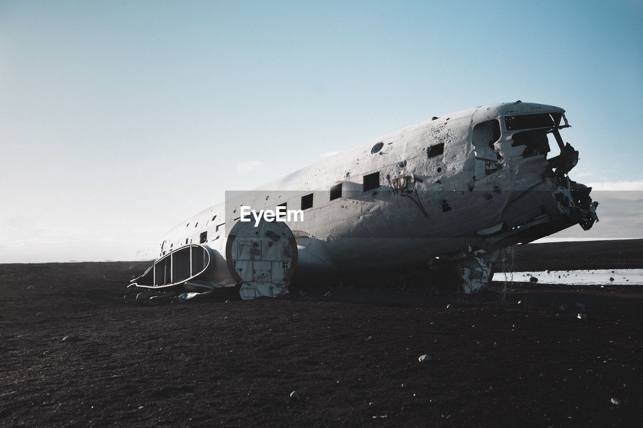 View of abandoned airplane in iceland against sky