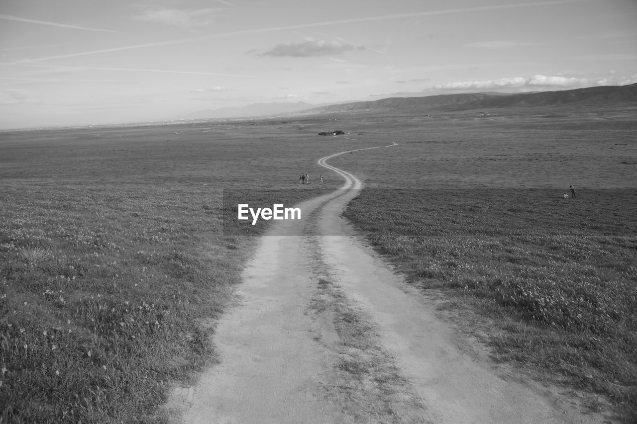 ROAD PASSING THROUGH FIELD