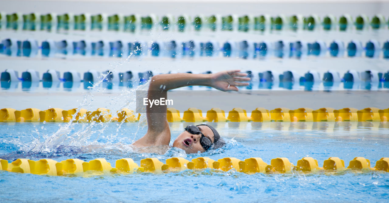 Boy swimming in pool