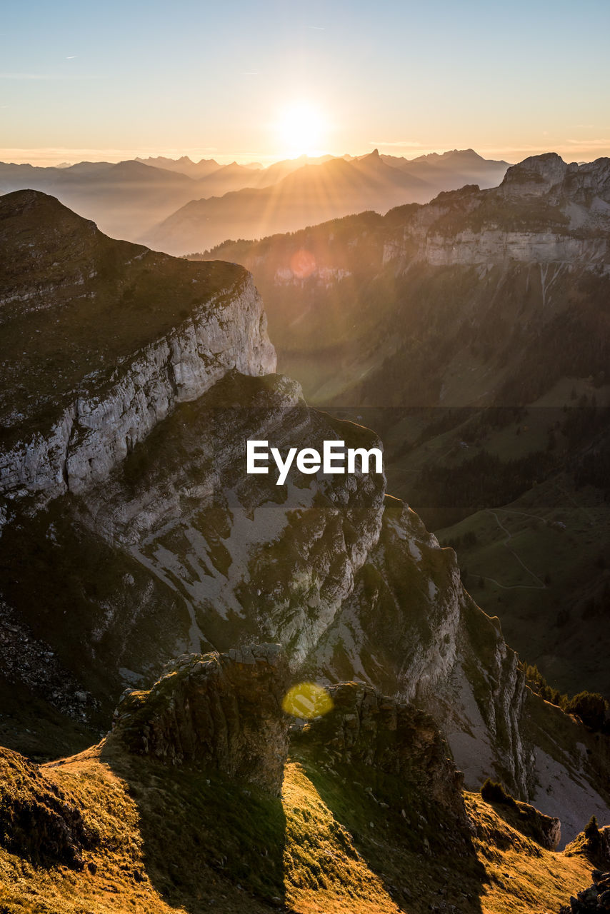 Scenic view of mountains against sky during sunset