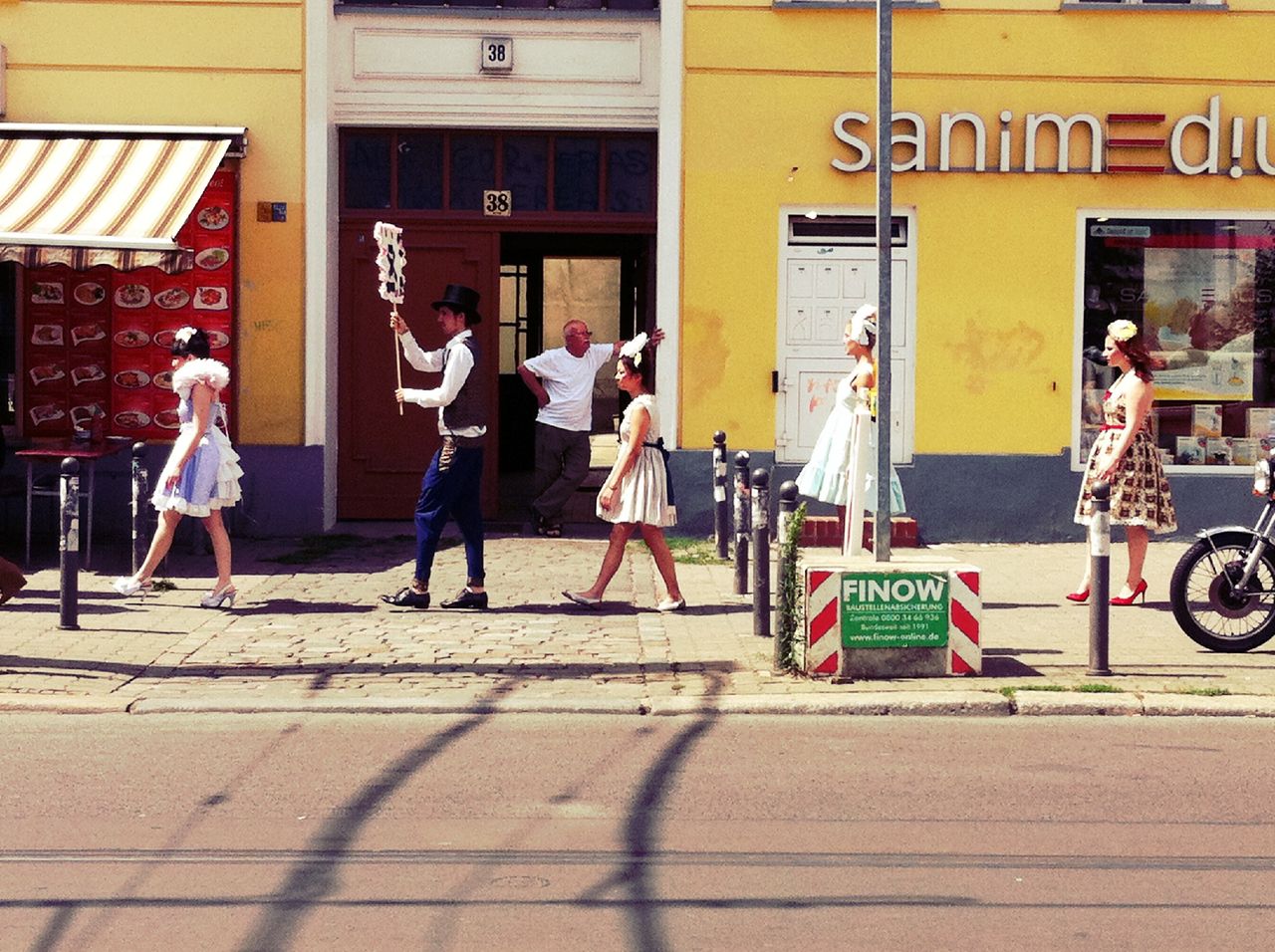 WOMAN STANDING ON CITY STREET