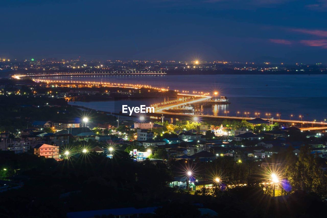 High angle view of illuminated buildings in city at night