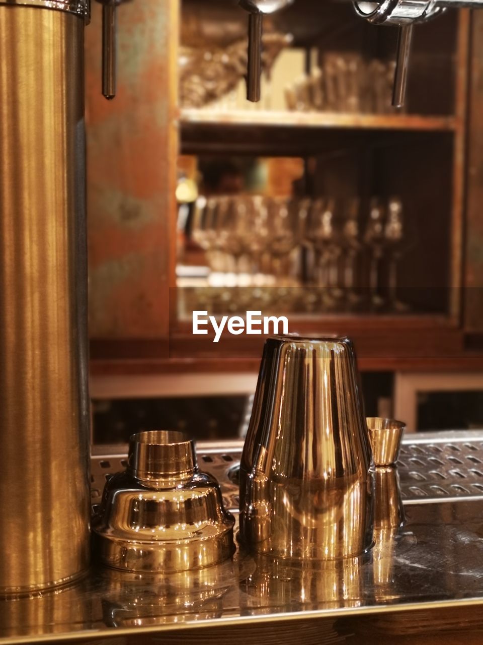 Close-up of cocktail shaker on counter at cafe