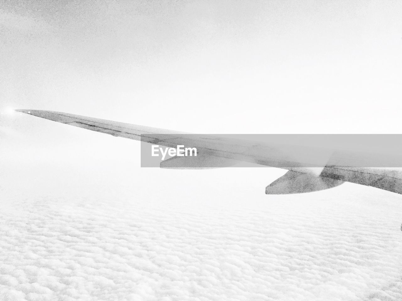 Cropped image of airplane in sky
