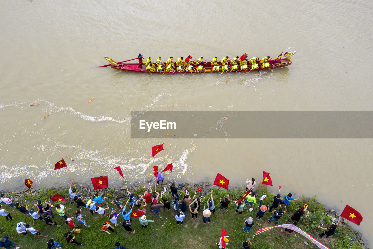 High angle view of people floating on river