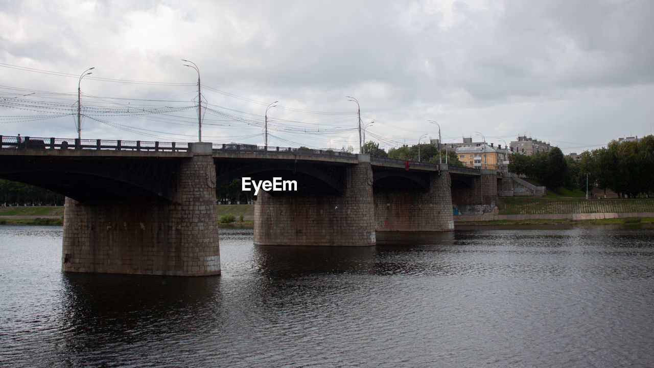 VIEW OF ARCH BRIDGE OVER RIVER AGAINST SKY