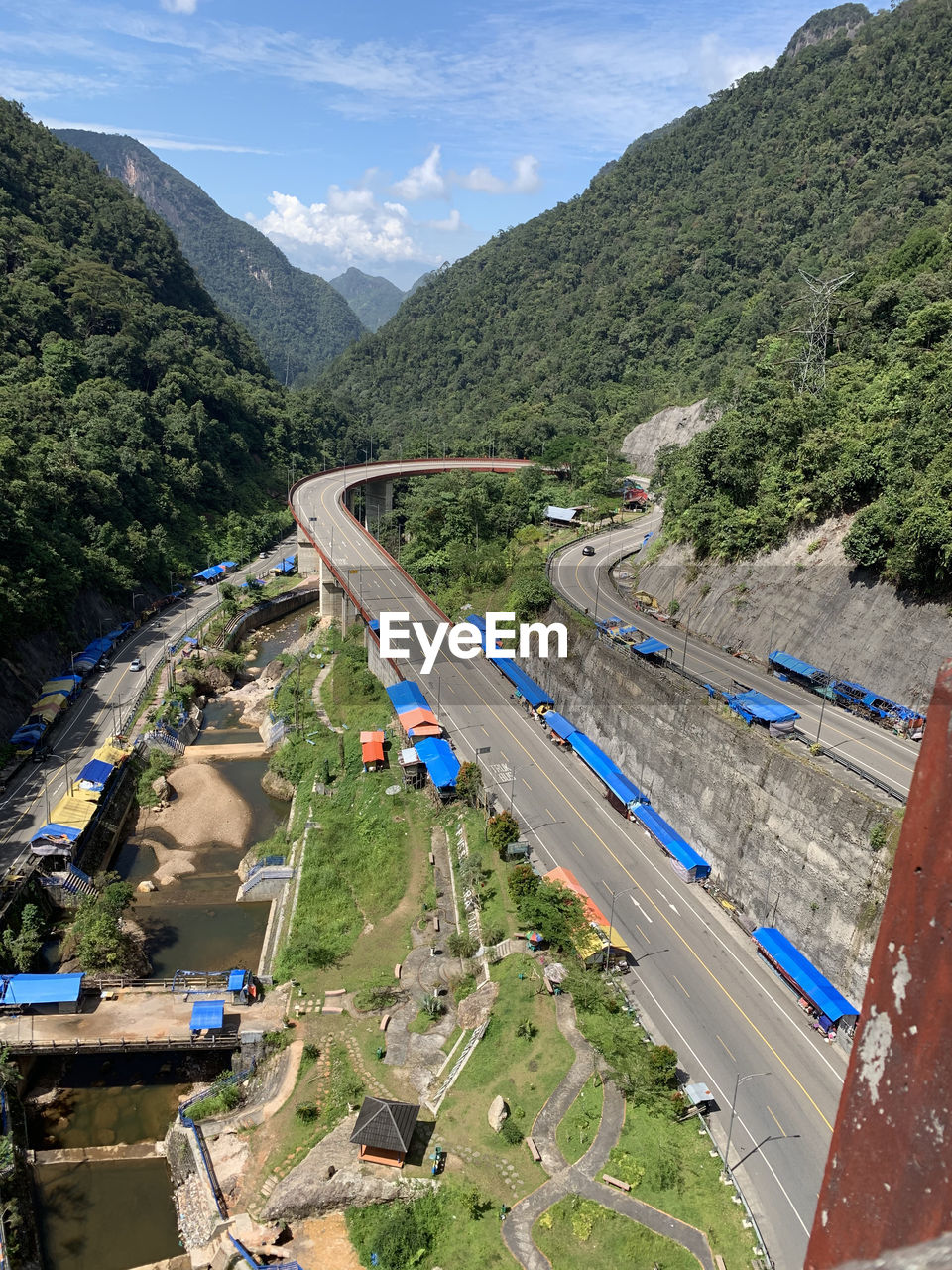 High angle view of road amidst mountains against sky