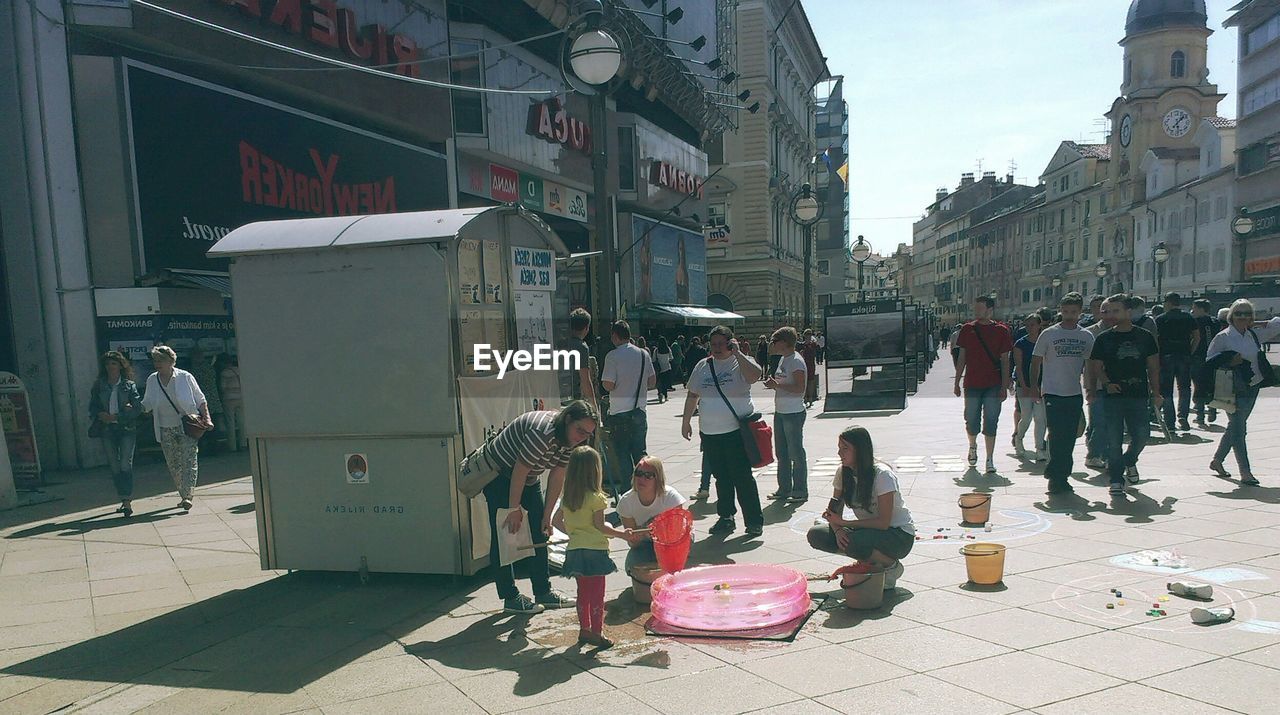 PEOPLE ON CITY STREET