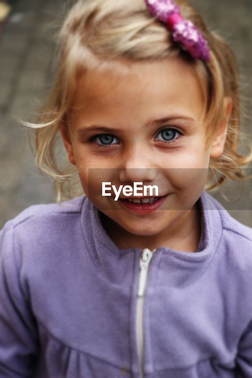 Close-up portrait of cute smiling girl