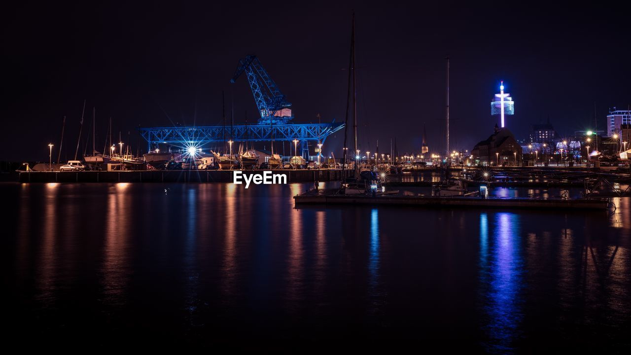 Illuminated city at waterfront