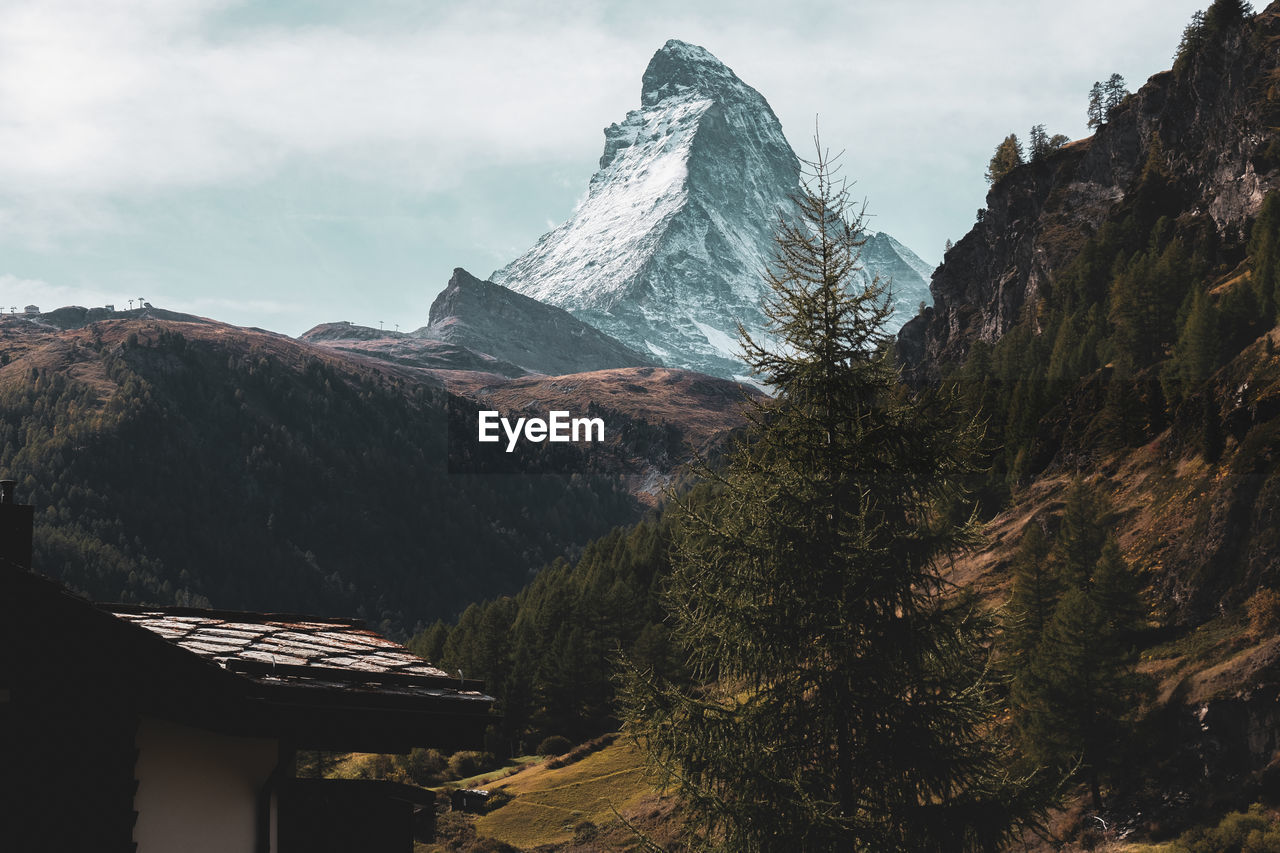 SCENIC VIEW OF SNOWCAPPED MOUNTAINS AGAINST SKY DURING WINTER