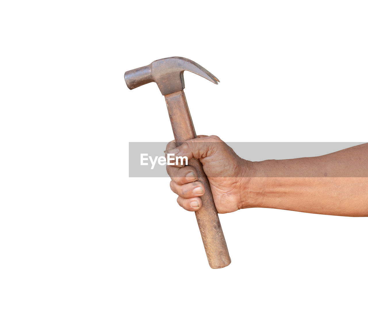 Close-up of hand holding hammer against white background