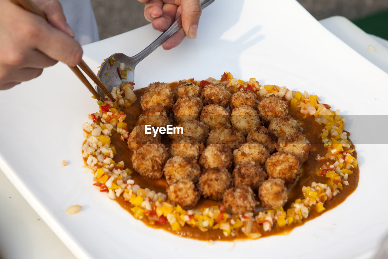 Cropped image of chef preparing food