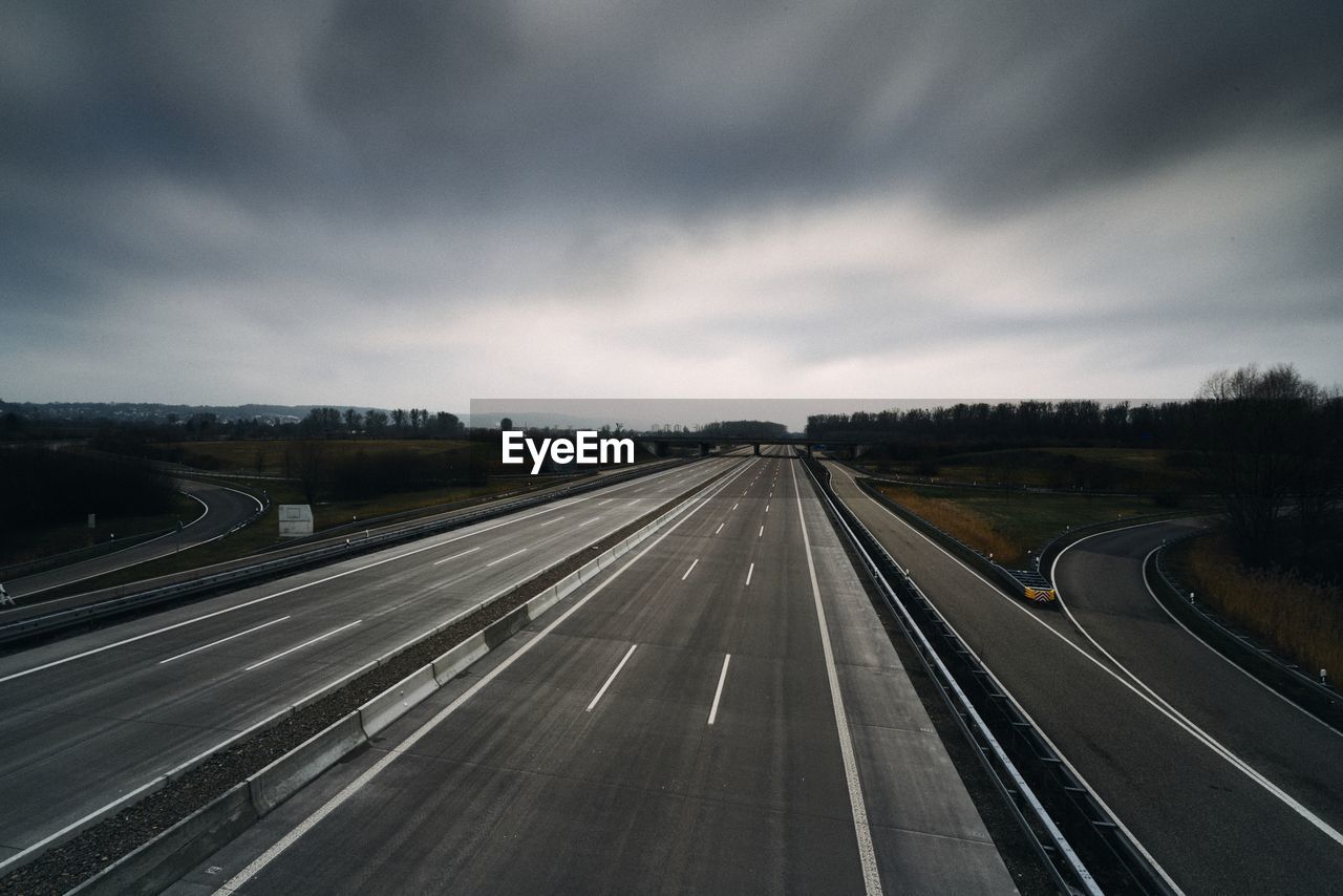 High angle view of highway against cloudy sky