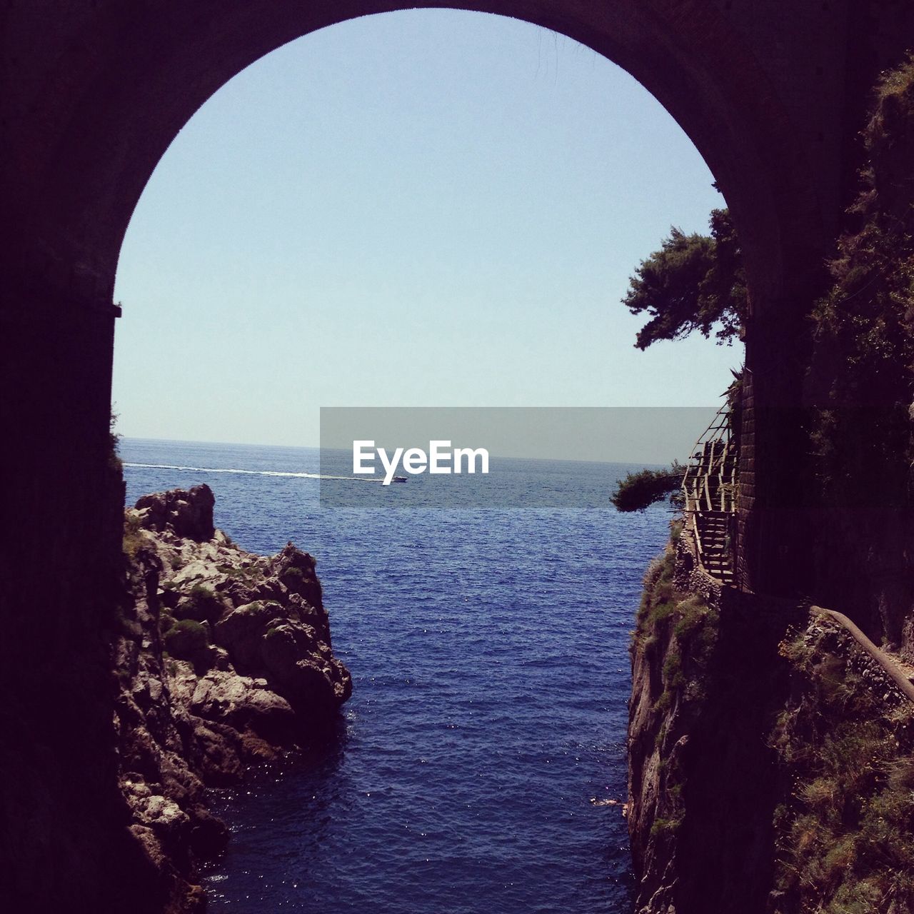 View of sea from below bridge