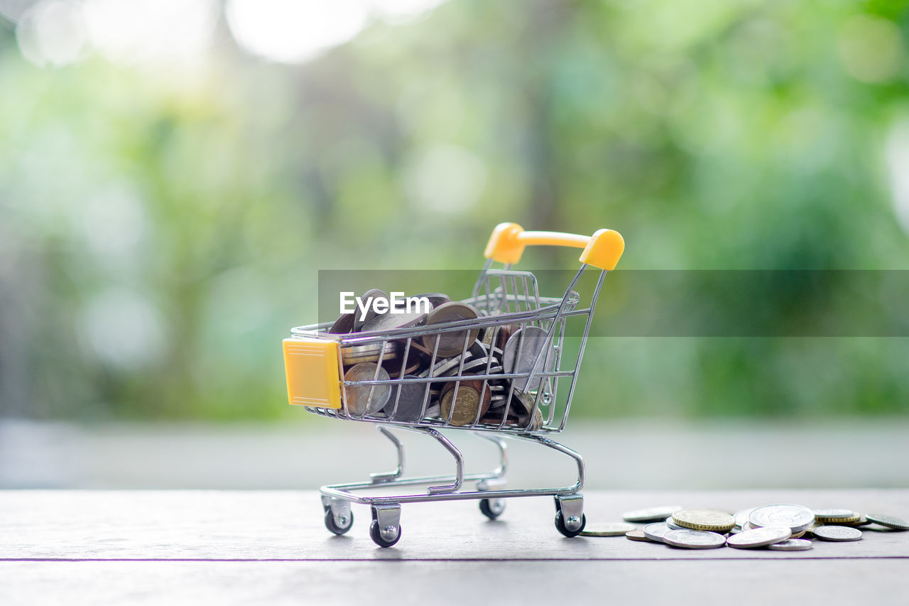 CLOSE-UP OF SHOPPING CART IN ROW