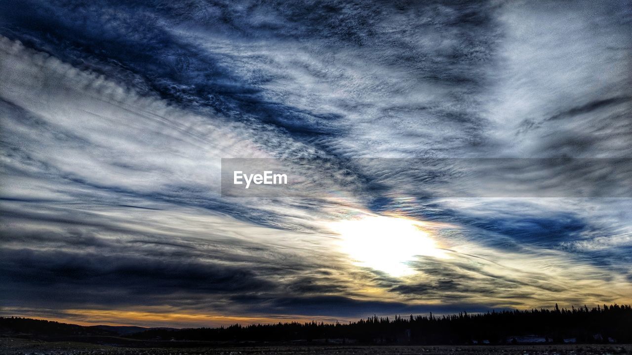 SCENIC VIEW OF LANDSCAPE AGAINST DRAMATIC SKY