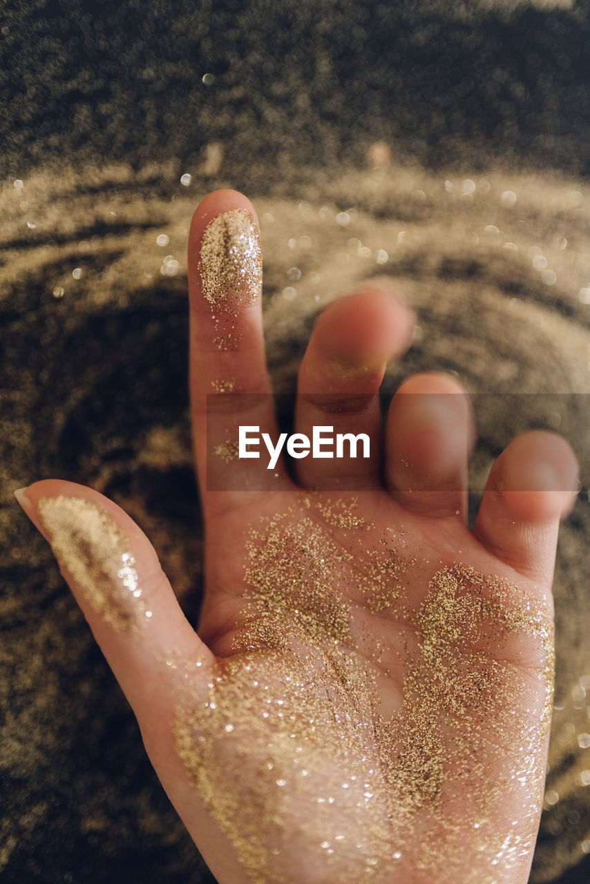 Close-up of hand with glitter