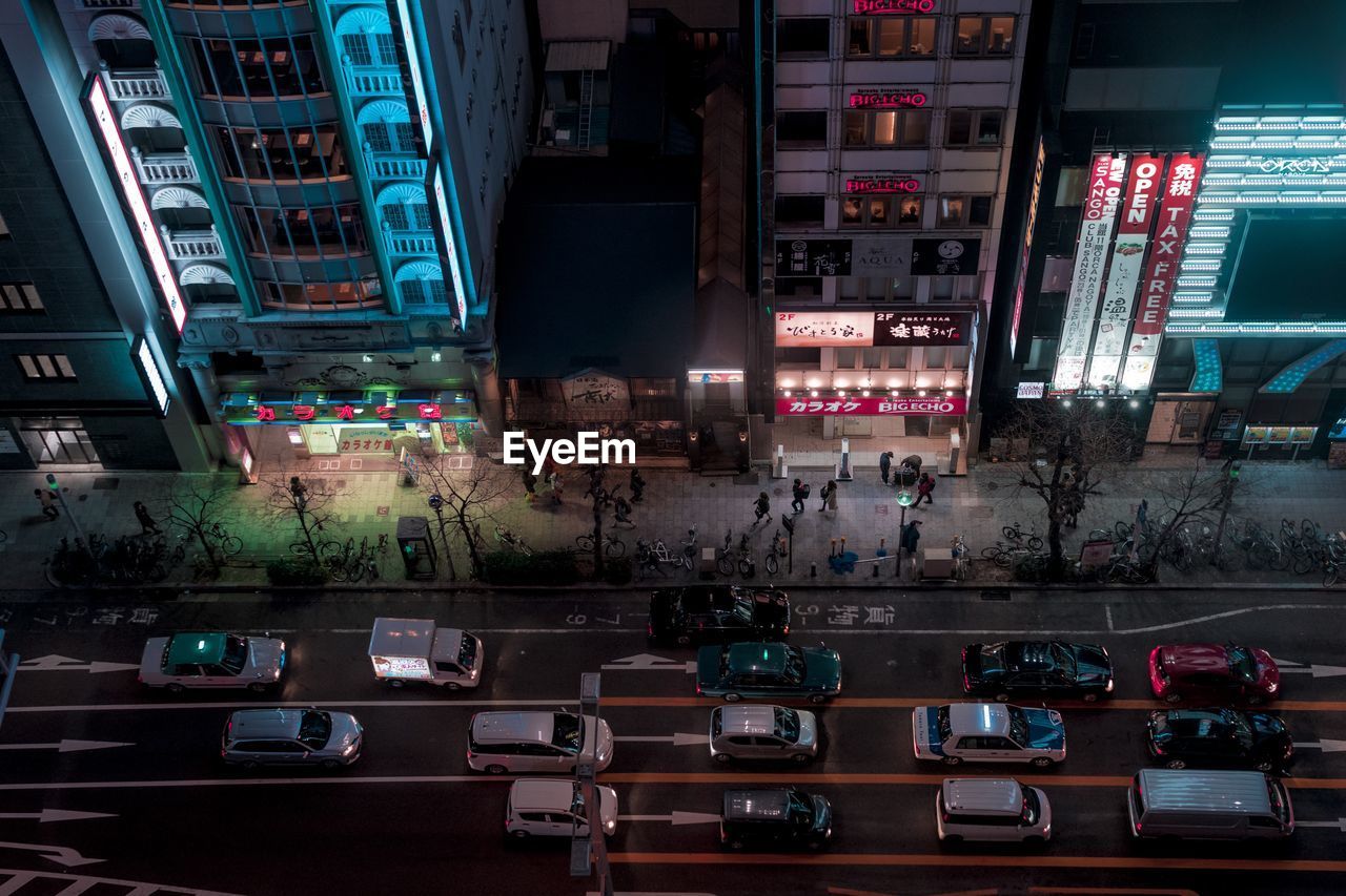 High angle view of traffic in illuminated city at night