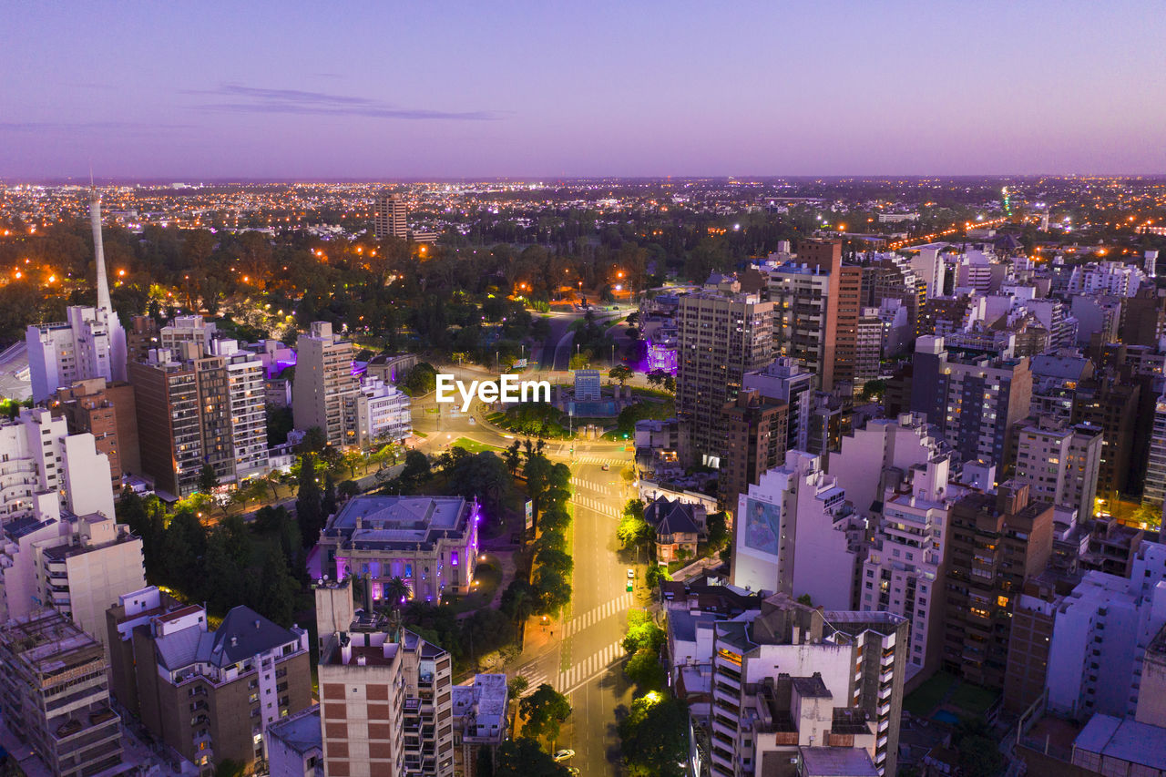 HIGH ANGLE VIEW OF ILLUMINATED BUILDINGS AGAINST SKY