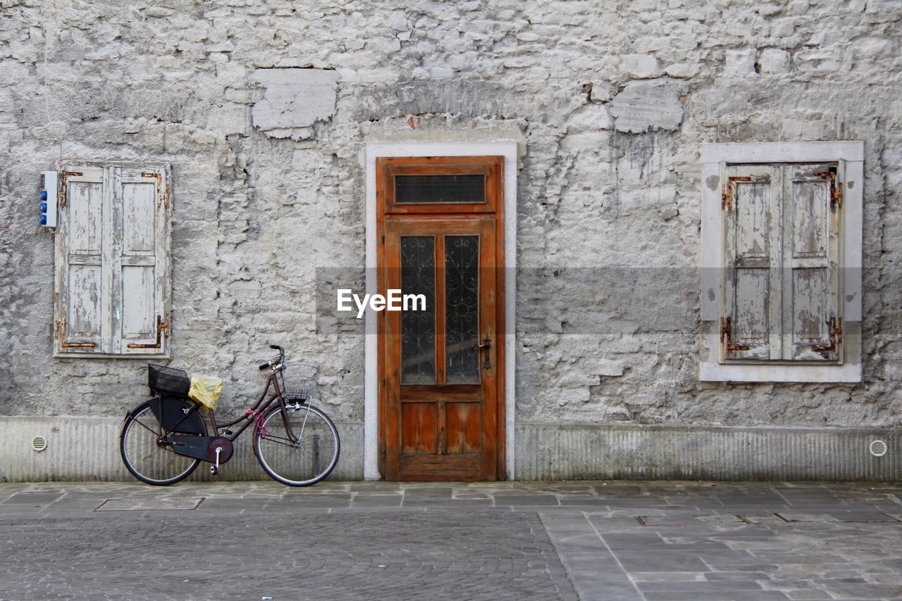 BICYCLE OUTSIDE HOUSE