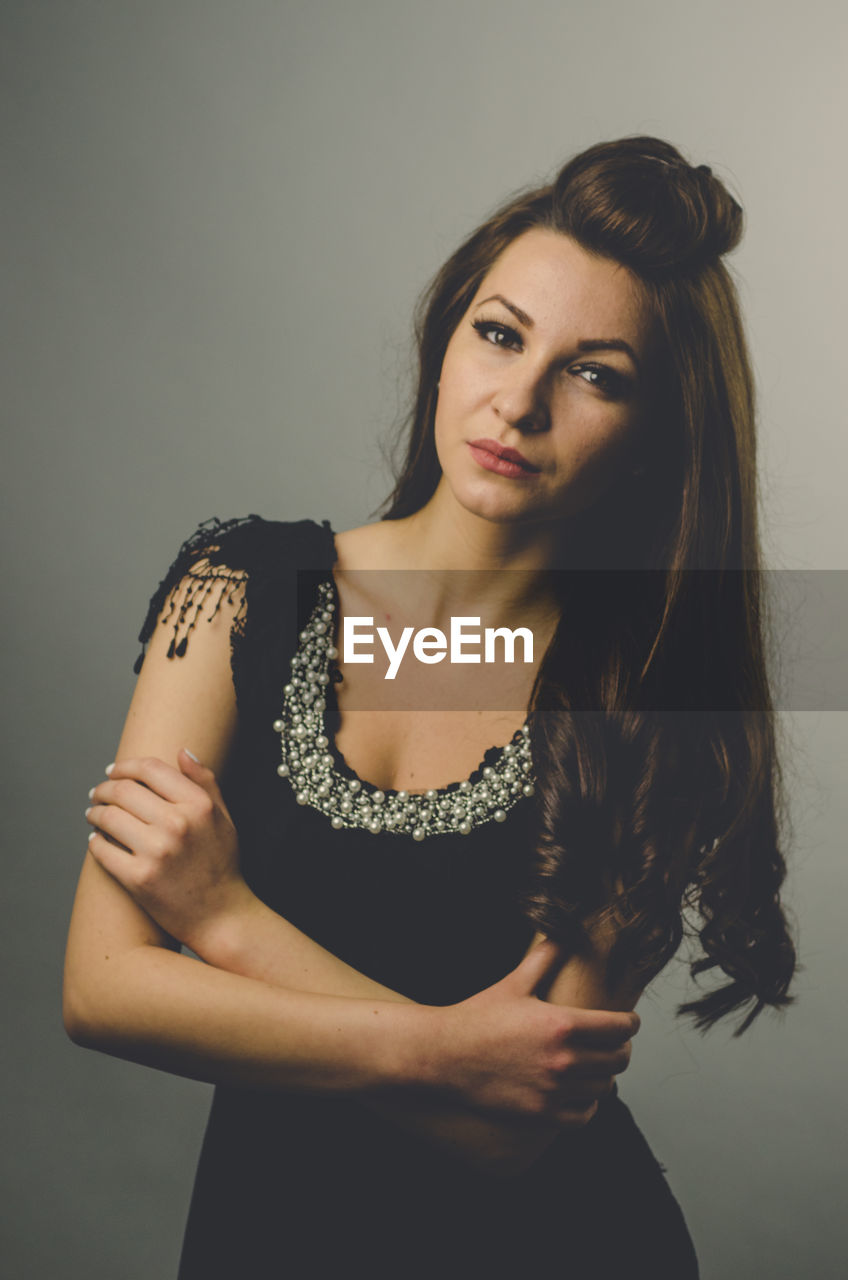 Portrait of a beautiful young woman over white background