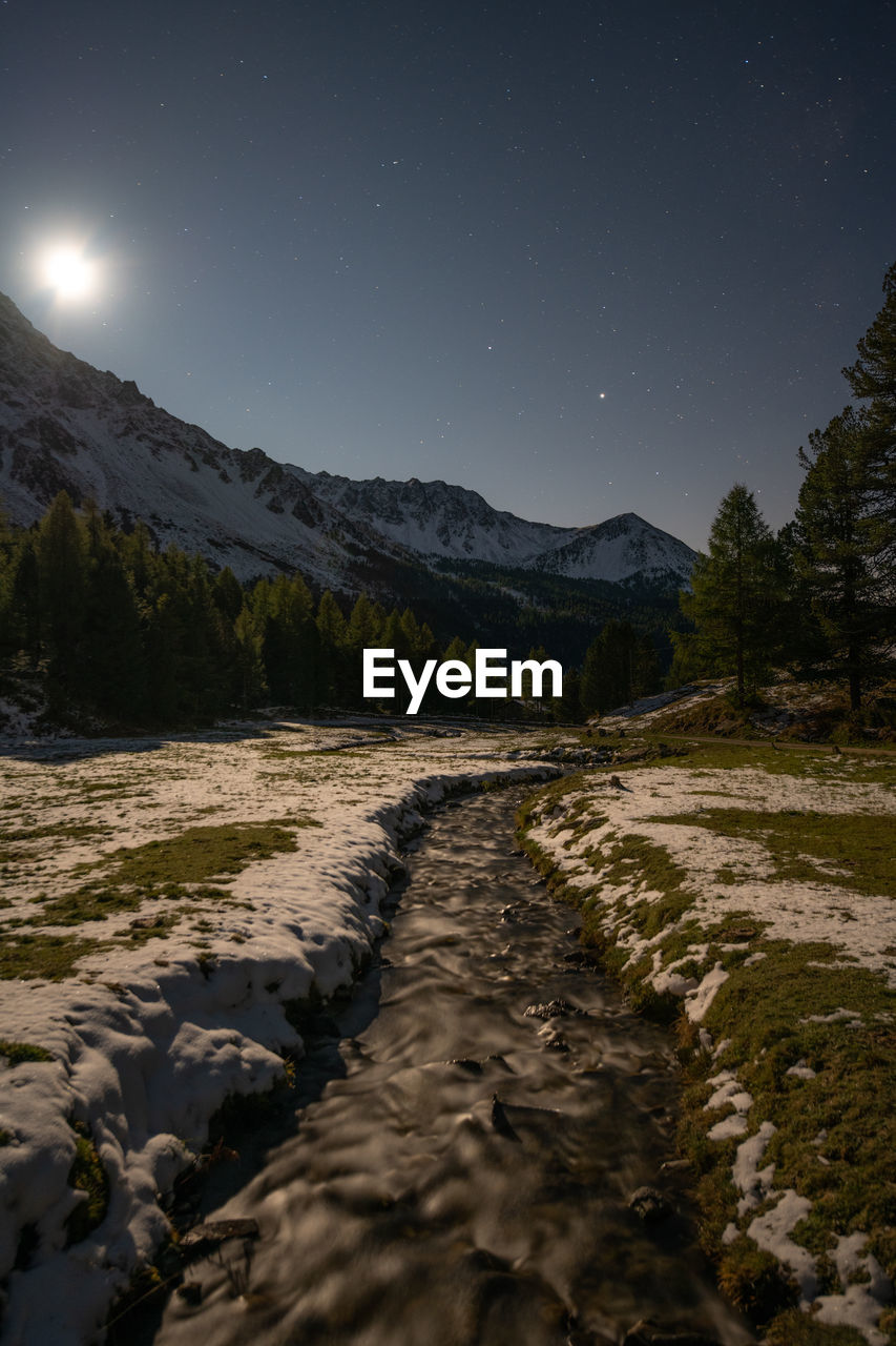 scenic view of mountains against sky at night