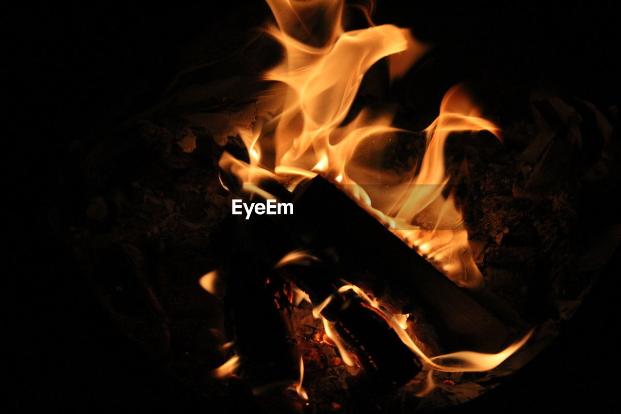 burning, fire, flame, heat, campfire, nature, log, firewood, wood, darkness, fireplace, no people, bonfire, close-up, night, glowing, camping, black background, motion, orange color, black, dark, yellow