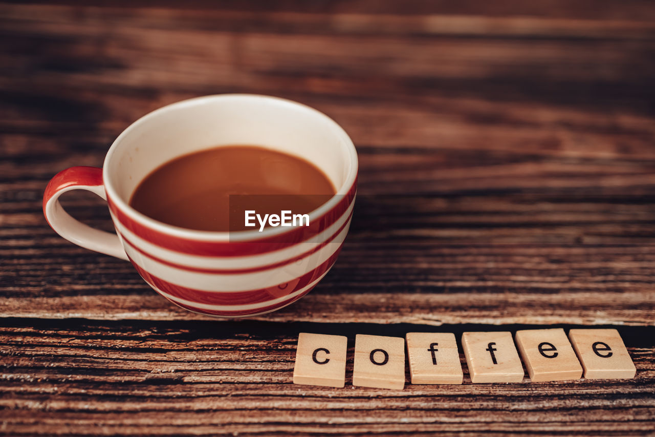 CLOSE-UP OF TEA CUP ON TABLE