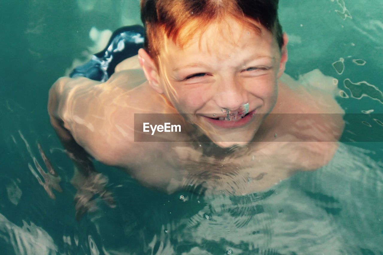 Portrait of young boy underwater