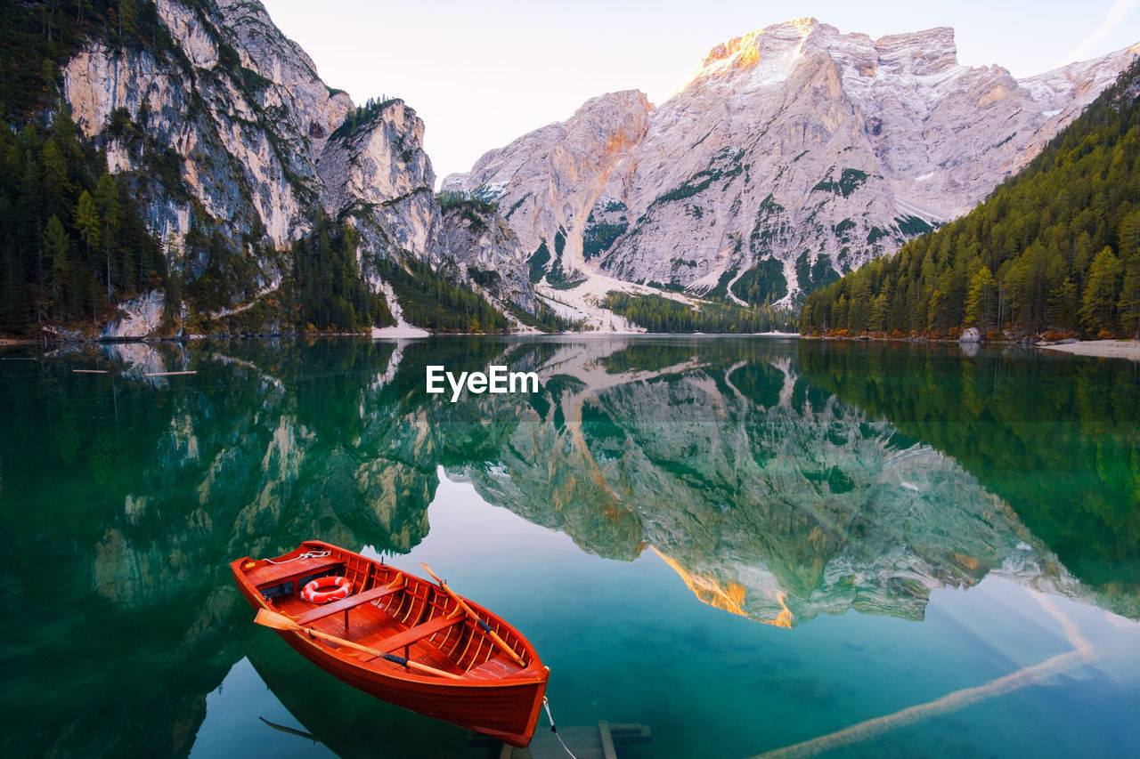 SCENIC VIEW OF LAKE AGAINST MOUNTAIN RANGE