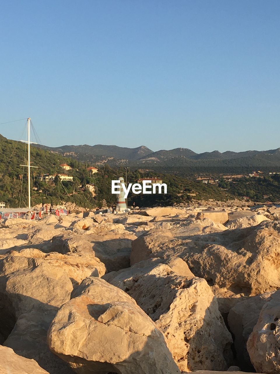 Scenic view of rocky mountains against clear blue sky