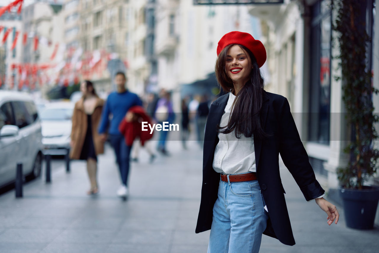 portrait of young woman standing on street