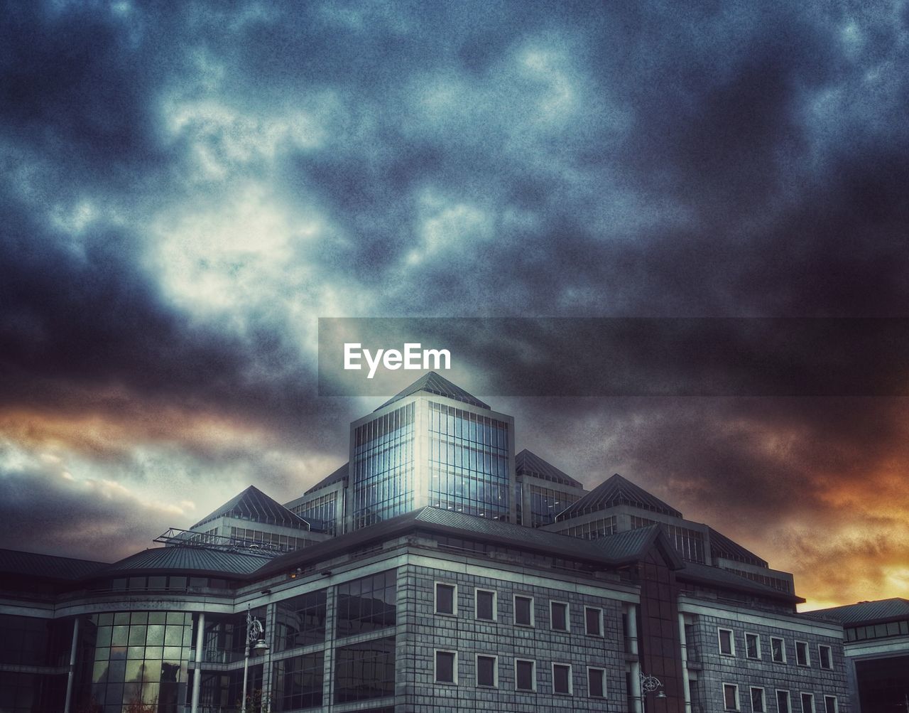 VIEW OF RESIDENTIAL BUILDINGS AGAINST CLOUDY SKY