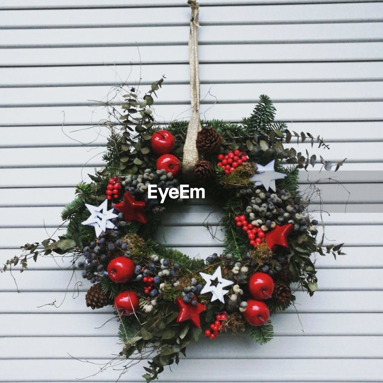 CLOSE-UP OF CHRISTMAS DECORATIONS HANGING ON TREE IN ROW