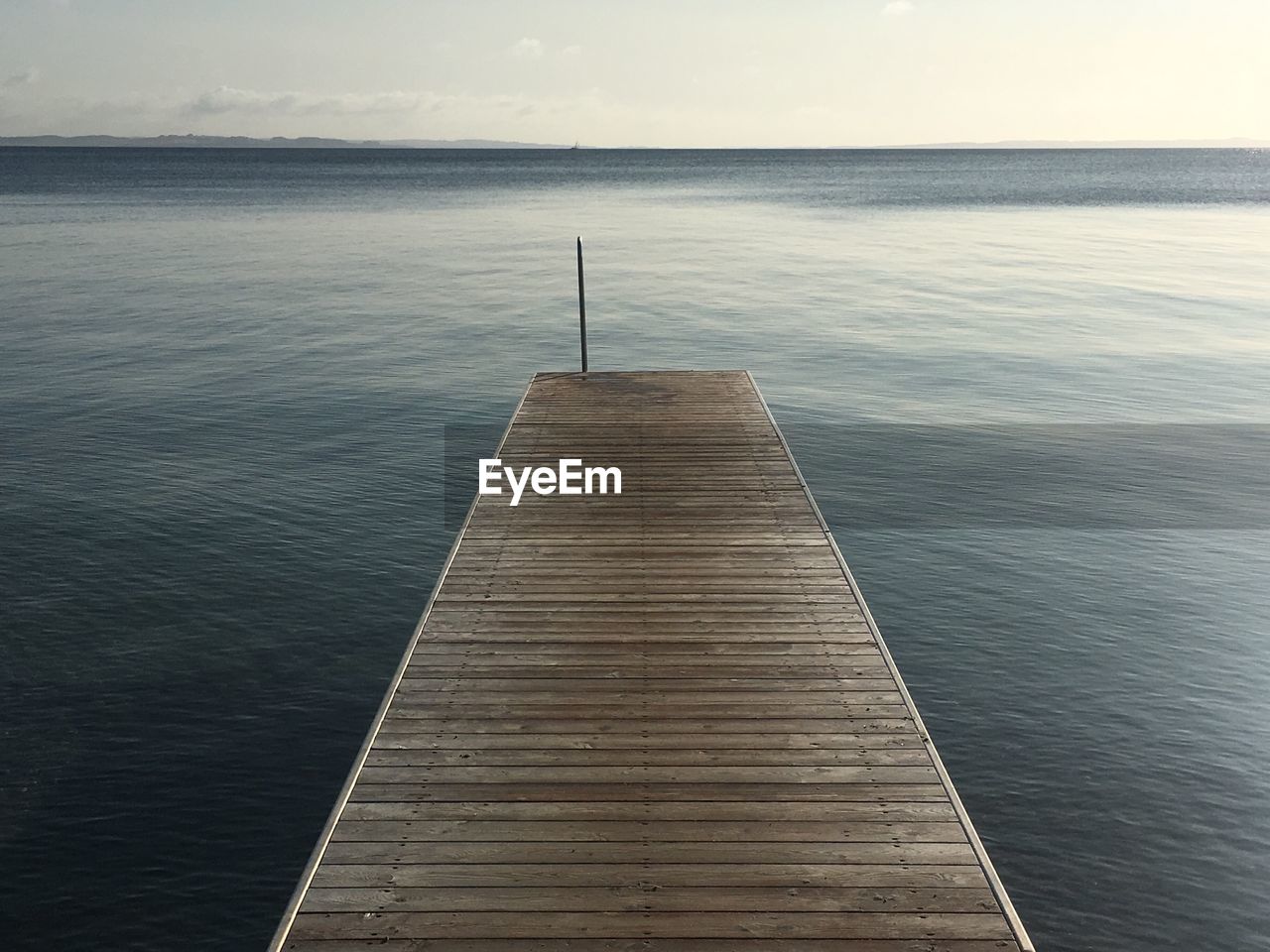 Pier over sea against sky