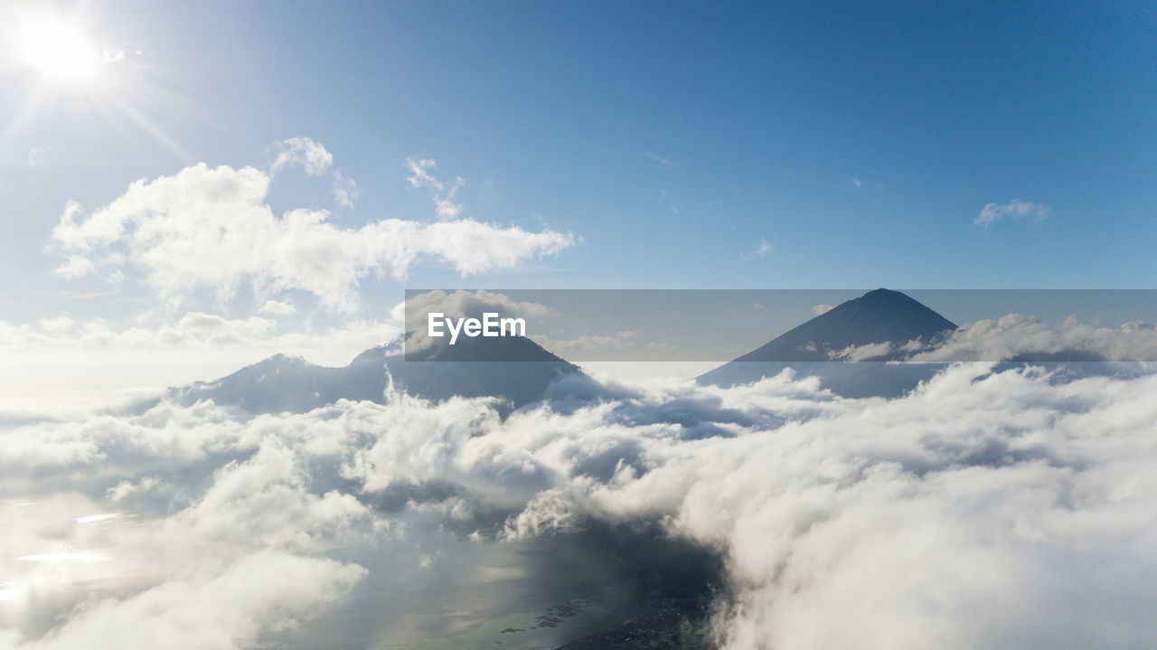 Low angle view of clouds against sky on sunny day