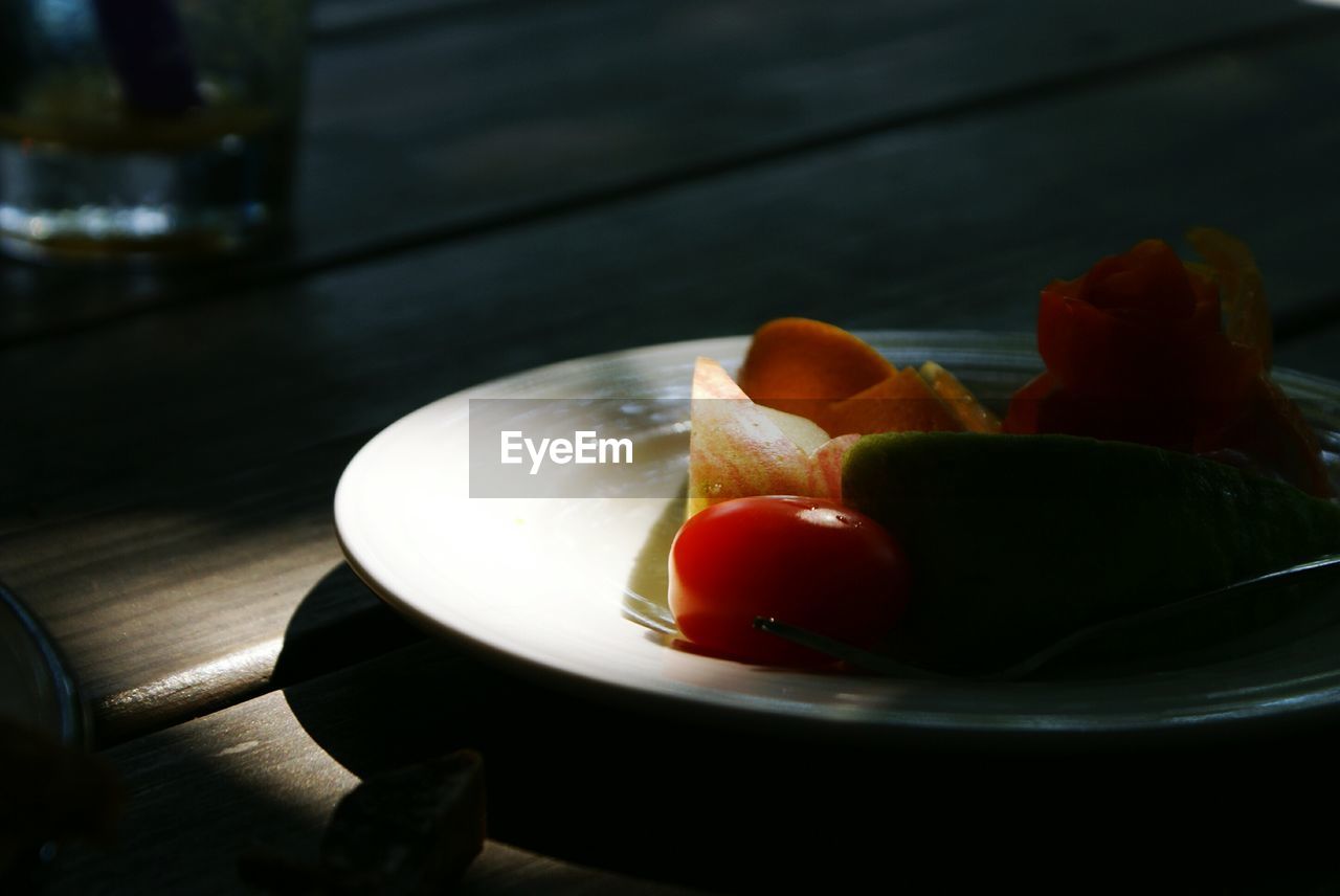 Close-up of fruits in plate on table